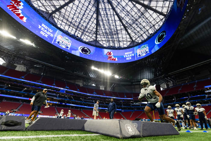 Penn State running back Nicholas Singleton runs through a drill during Peach Bowl practice at Mercedes-Benz Stadium in Atlanta.